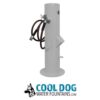 A gray outdoor water fountain with a hose and faucet attachment, standing upright on a round base. Below is the "Cool Dog Water Fountains.com" logo featuring a dog's head illustration.
