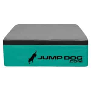 The Jump Training Agility 12" Cushion Platform is a rectangular teal and gray cushion with a black jumping dog silhouette and "JUMP DOG .COM" printed on the side.