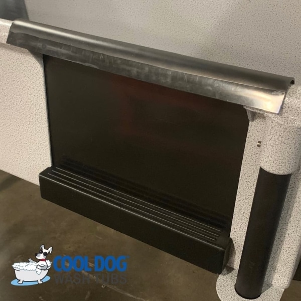 The Cool Dog Wash Tub - Architectural Series - Splash Guard Door features a stainless steel step with black non-slip surface; the lower left displays the "Cool Dog Wash Tubs" logo with a cartoon dog in a bathtub.