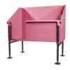 A pink elevated pet washing station with black adjustable legs, splash guard panels on three sides, and a small faucet attachment on the back edge.